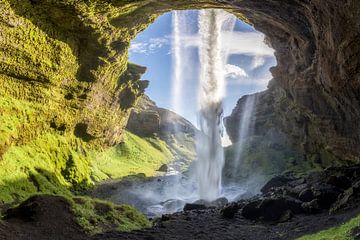 Kvernufoss waterfall in summer with blue sky in Iceland