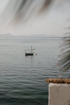 Calm sea with a small boat near Alcúdia, Mallorca