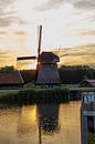 Holländische Mühle im Sonnenuntergang von Paul Franke Miniaturansicht