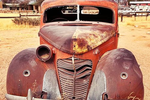 an American classic car wreck in the desert