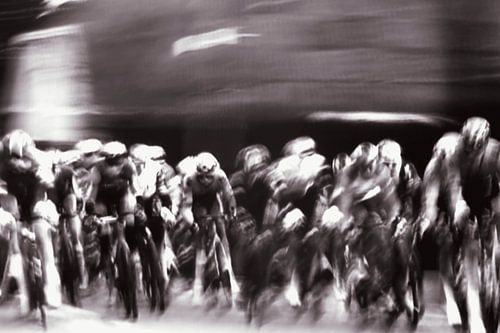 Cycling peloton comes out of the corner