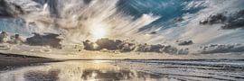 The North Sea beach with a low sun by eric van der eijk