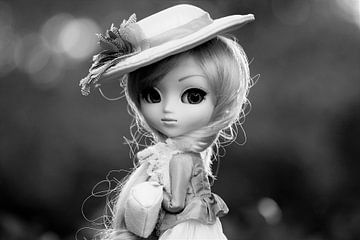 Girl's doll with a hat on in black and white