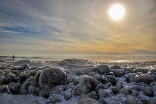 A frozen IJsselmeer with setting sun.