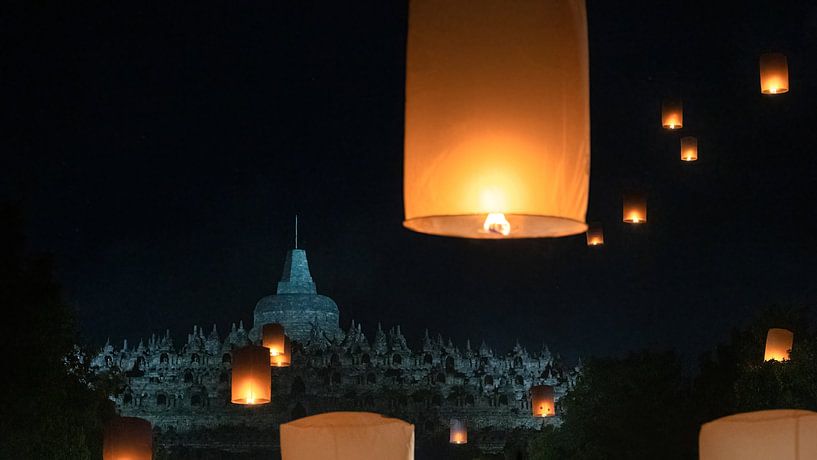 Lighting the lanterns at the Borobudur by Anges van der Logt