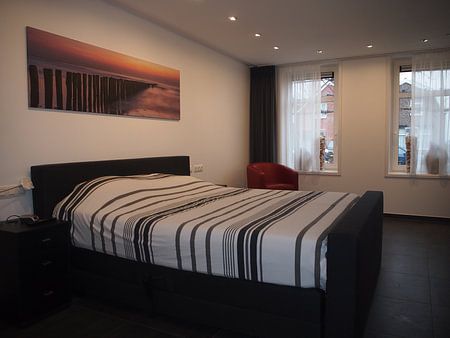 Breakwaters Cadzand-Bad during sunset.