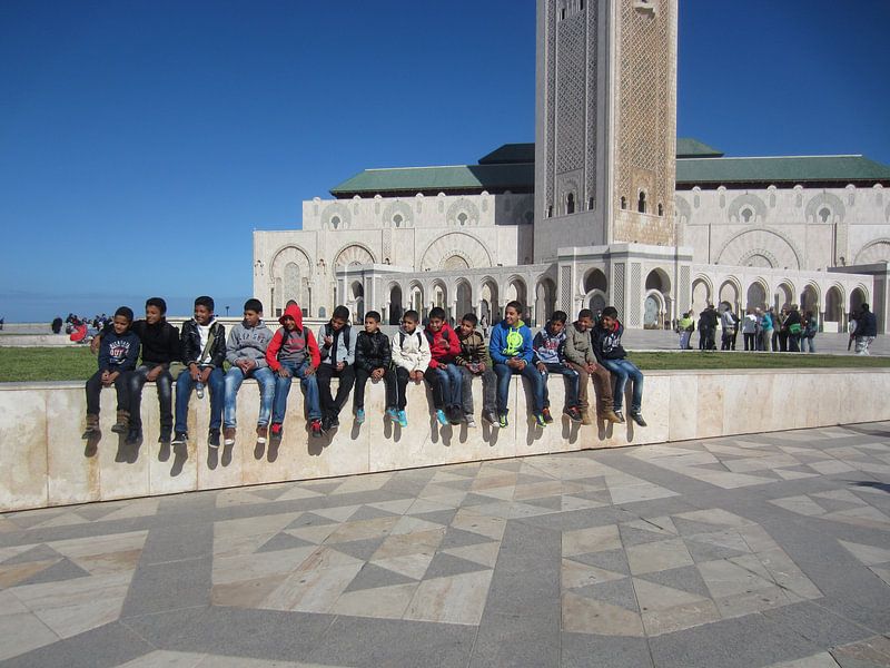 Boys in front of the Hassan II Mosque by Job ter Steege