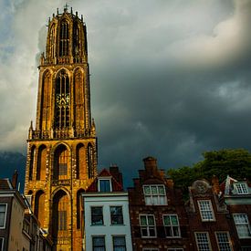 Cathedral tower under thunderstorm sky. by Ramon Mosterd