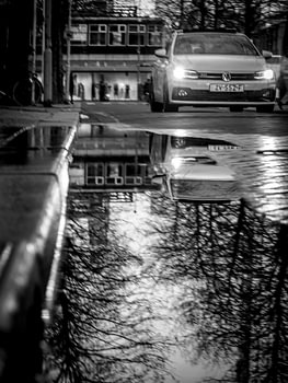 Street photography with car reflection