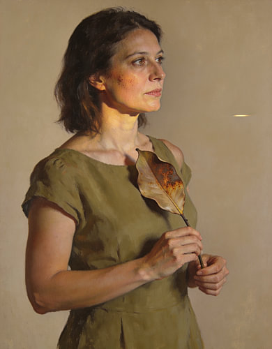 Woman Holding a Dried Magnolia Leaf