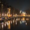 Een Winteravond aan de Kloveniersburgwal - Oude markt Amsterdam van Rudolfo Dalamicio