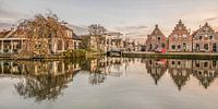 Zonsondergang  en de binnenhaven van Makkum in Friesland par Harrie Muis Aperçu