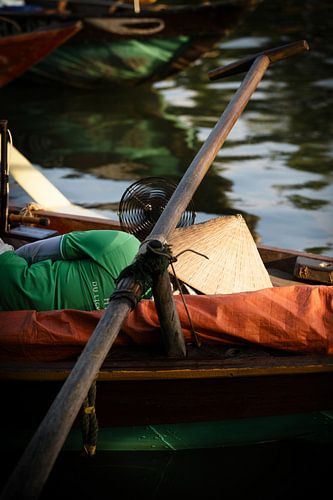 Sieste d'': a boatman in a traditional boat