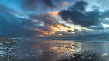 Dutch skies on the coast, a battle between sun and rain by Bram Lubbers