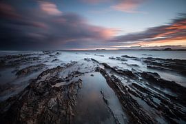 dramatic sunset - tidal rock formation