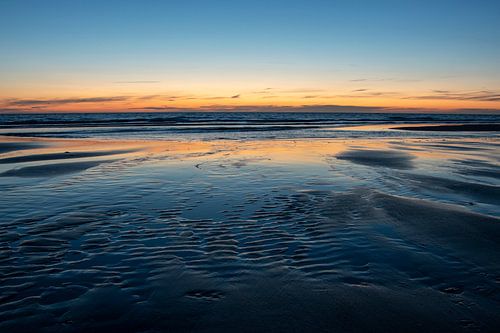 Beach of Katwijk with setting sun