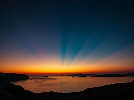 Magical sunset with radiant sky over serene sea by jmk