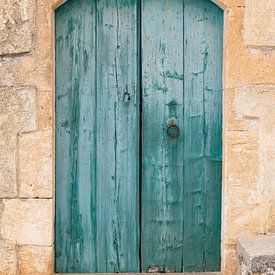 A green-and-blue wooden door in Crete by Cindy Mulder