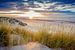 Zonsondergang boven het strand van Ameland. van Karel Pops