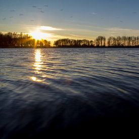 Sunset over a lake von Hugo Winder