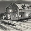 Elsloo in de avond in de winter met sneeuw in houtskool van Maurice Meerten
