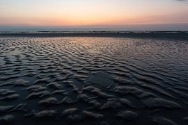 Colorful reflections on a wet beach by Alexander Tromp