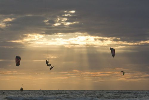 kite-surfer flies off into the sunset