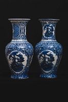 Delft blue vase with black background
