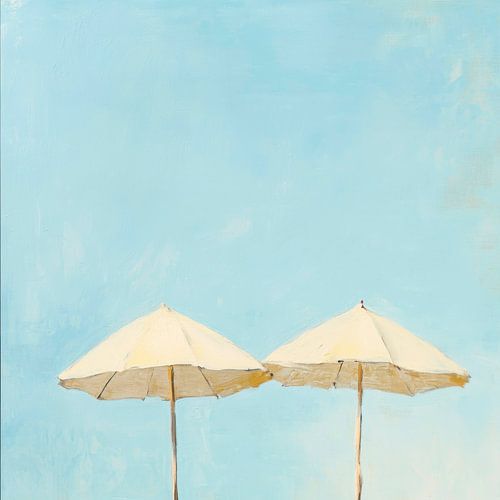 Two umbrellas in the blue sky