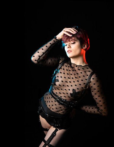 Glamour studio portrait of a 23 year old white woman with short,