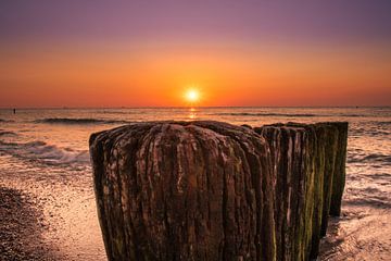 Sunset Domburg from behind the breakwaters. by Rick van de Kraats