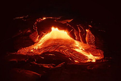 Details of an active lava flow, hot magma emerging from a fissure