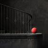 Ancient Stairs and Modern Strength - A Red Ball Beams by Karina Brouwer