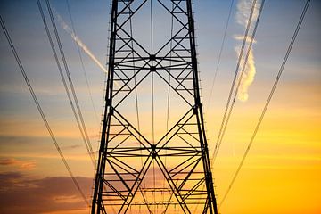 High Voltage electricity transmission towers during sunset by Sjoerd van der Wal Photography