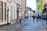 Nostalgic street with people in motion in Breda