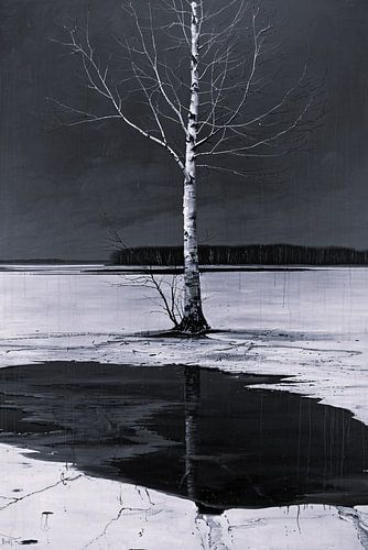 Arbre solitaire au bord d'un lac gelé