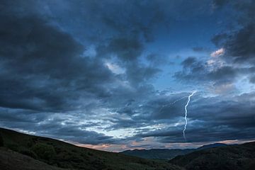 Evening twilight in landscape with lightning flash. by Albert Brunsting