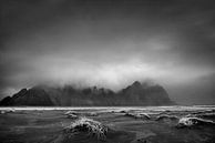 Black lava beach with mountain scenery on Iceland. Black and white image. by Manfred Voss, Schwarz-weiss Fotografie thumbnail