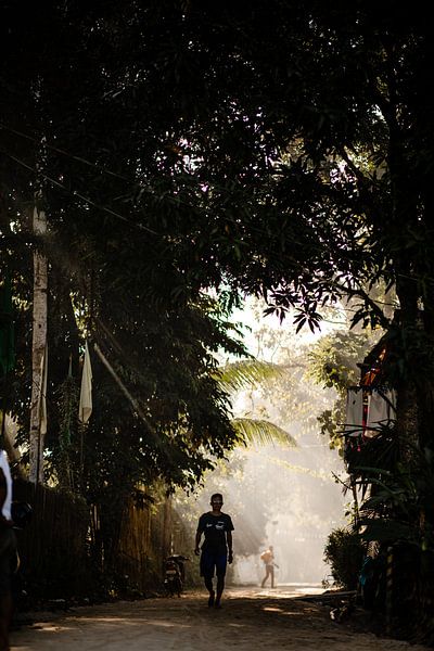 Man in village in Philippines by Yvette Baur