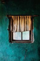 Weathered window with curtain