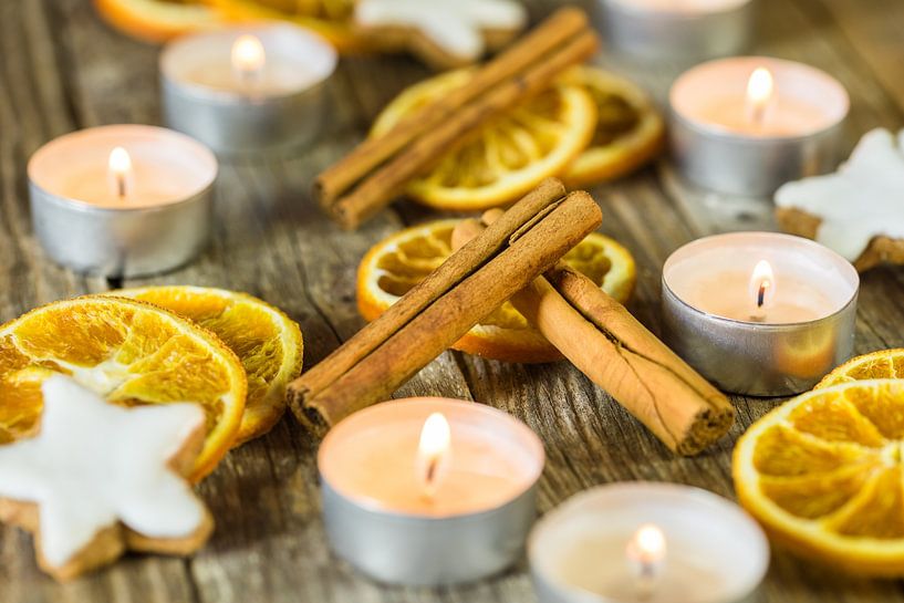 Christmas candles, cookies and spices decoration on wood by Alex Winter