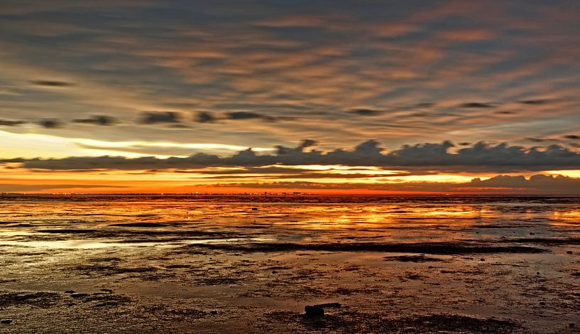 sunset waddensea by rene schuiling