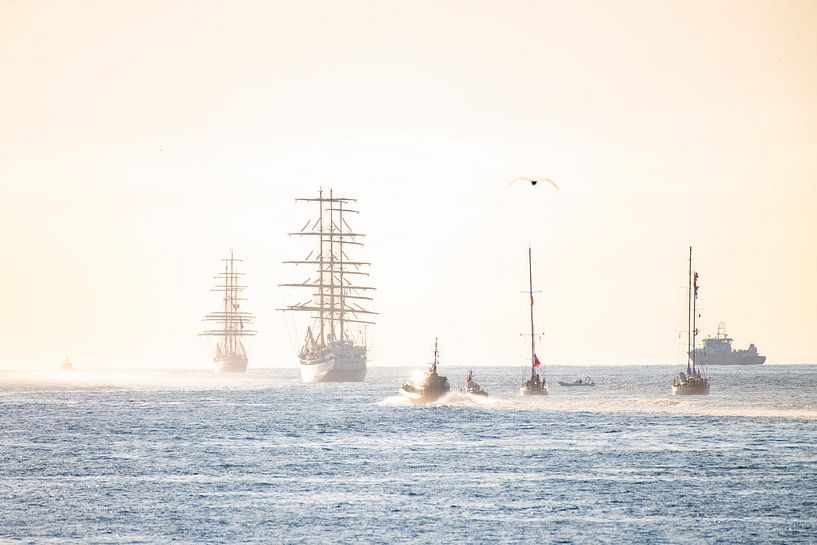 Side ships slowly disappear on the horizon after Sail. by Brian Morgan