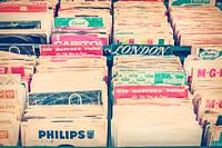 Boxes with vinyl turntable records on a flee market