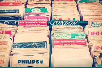 Boxes with vinyl turntable records on a flee market