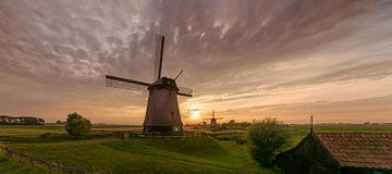 Trois moulins à vent dans le polder Beemster sur Toon van den Einde