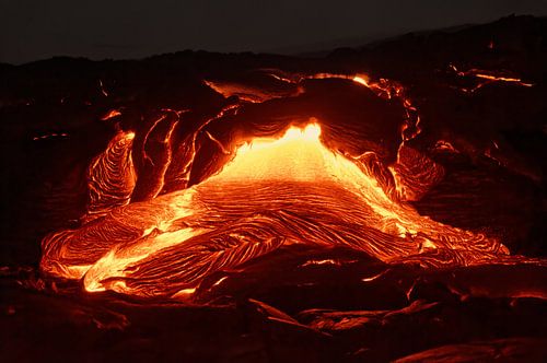 Details of an active lava flow, hot magma emerging from a fissure