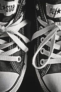 All Star sneakers close-up in black and white by Jeans and Stuff