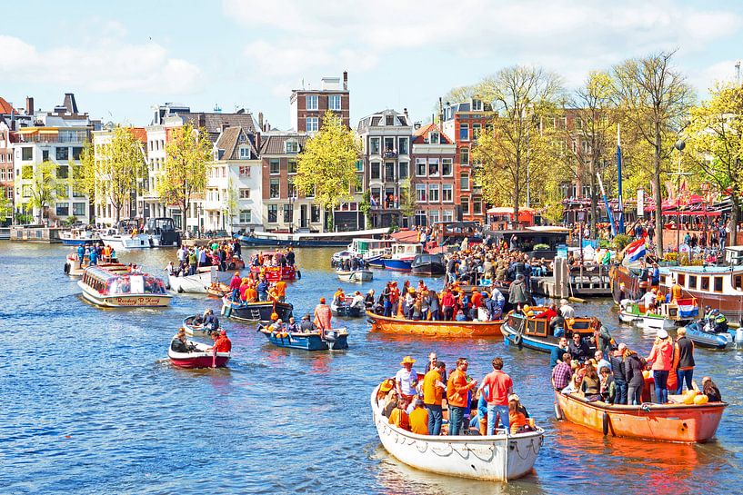 Celebration of King's Day on the canals in Amsterdam Netherlands by Eye on You