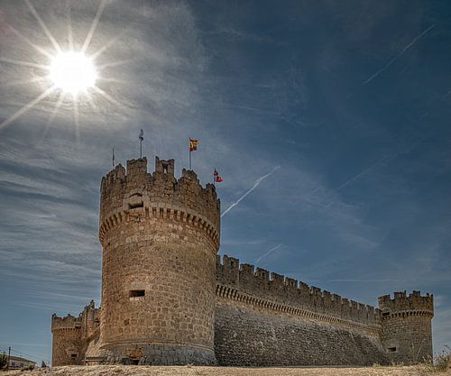 Ampudia castle in northern Spain in the sun's sidelight